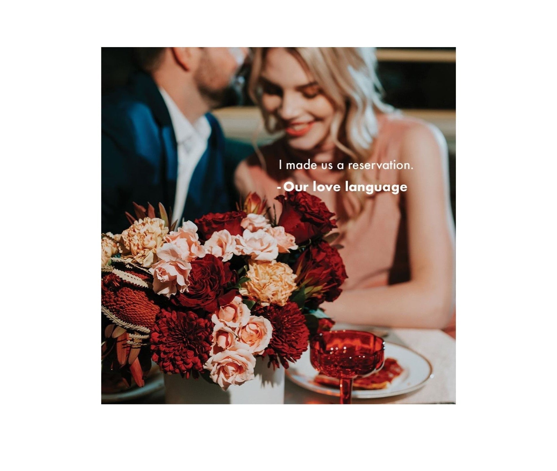 Romantic dinner setup with flowers for dreams, red blooms, and a couple sharing smiles.
