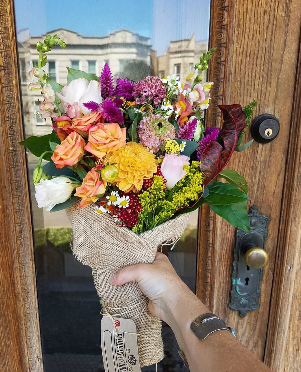 Flower of Dreams’ pastel and purple bouquet featuring roses, lilies and textured seasonal blooms.