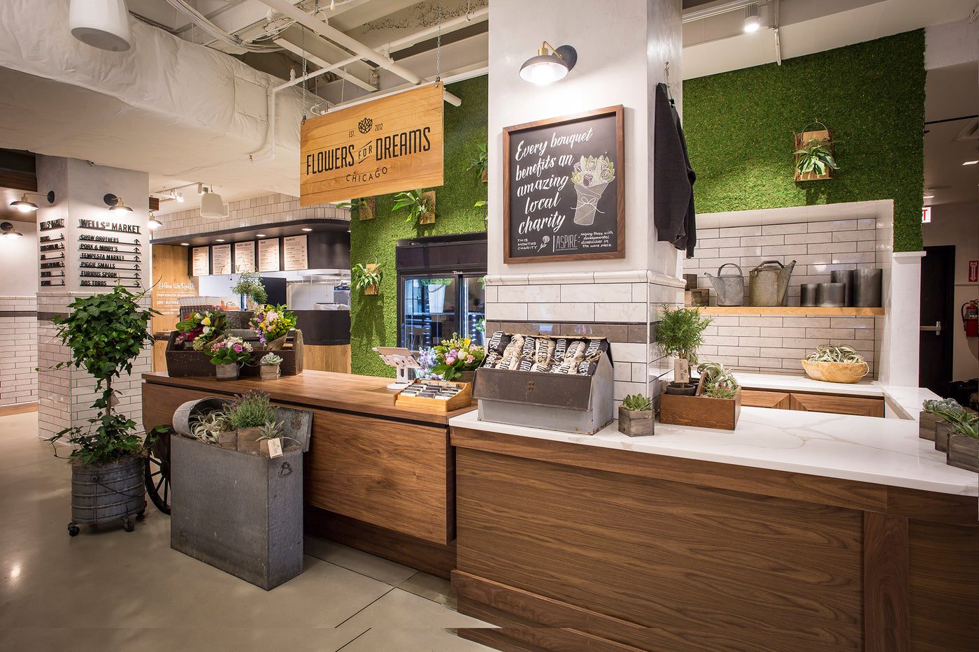 Modern interior design with wooden counters, plants, and decorative elements.